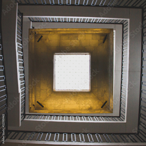 Yellow light cube in the center of a building