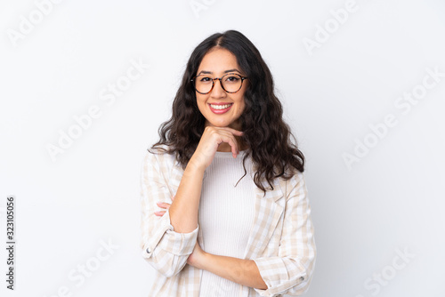 Mixed race woman over isolated white background with glasses and smiling