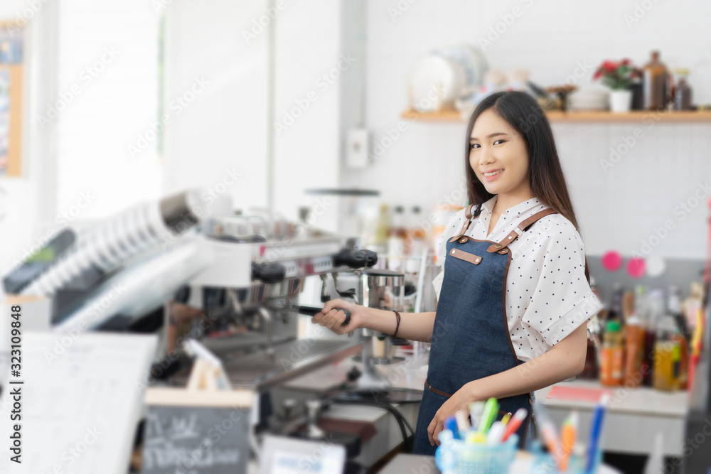 Happy Asian woman barista working, Successful small business owner standing with crossed arms preparing coffee, success to make sme business, professional occupation looking at camera in restaurant Happy Asian woman barista working, Successful small business owner standing with crossed arms preparing coffee, success to make sme business, professional occupation looking at camera in restaurant