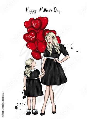 Mom and daughter in identical dresses. Family with beads in the shape of hearts. Family look. Fashion and style, clothes and accessories. Girl and woman. Mothers Day.