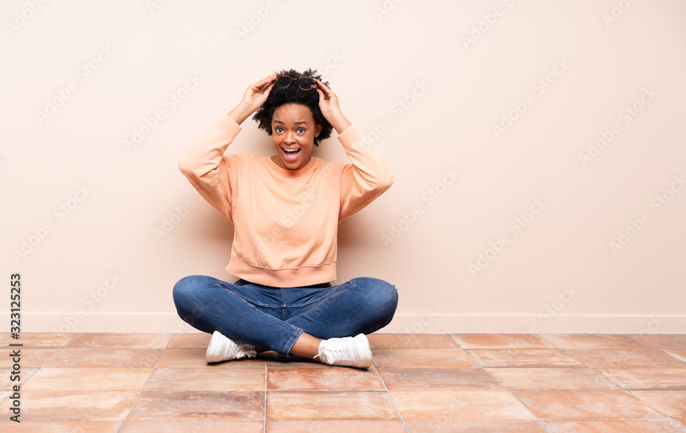 African american woman sitting on the floor African american woman sitting on the floor