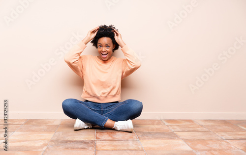 African american woman sitting on the floor