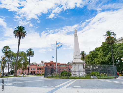 Piramide de Mayo with Casa Rosada in background. Plaza de Mayo historical landmark.