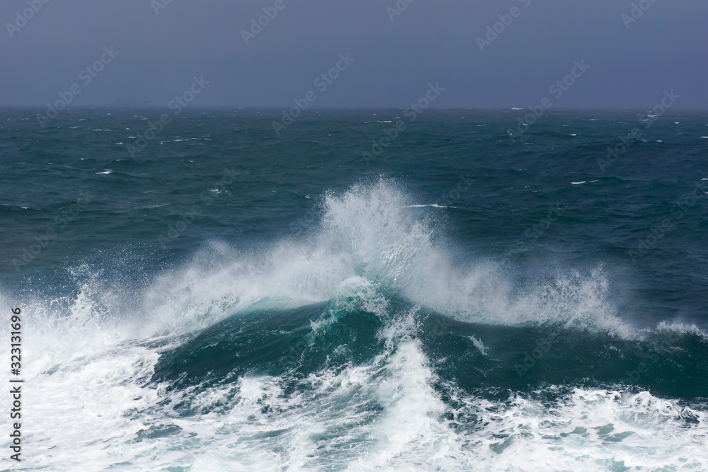 waves crashing on the open sea, stormy weather waves crashing on the open sea, stormy weather