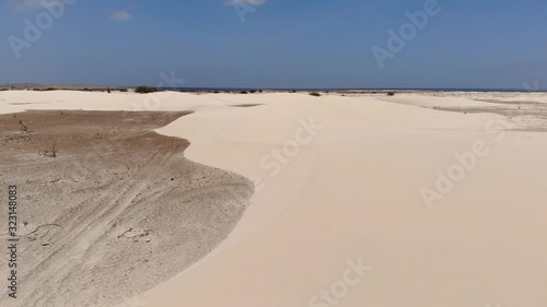 Aerial view footage of the desert and the sand dunes near the praia de varandinha in Boa Vista island, Cape Verde, Africa photo