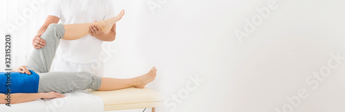 Masseur Giving Leg Massage To Woman