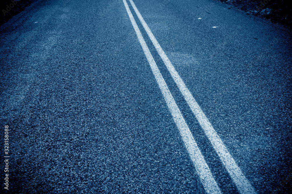 Local details of asphalt road, blue tone Local details of asphalt road, blue tone