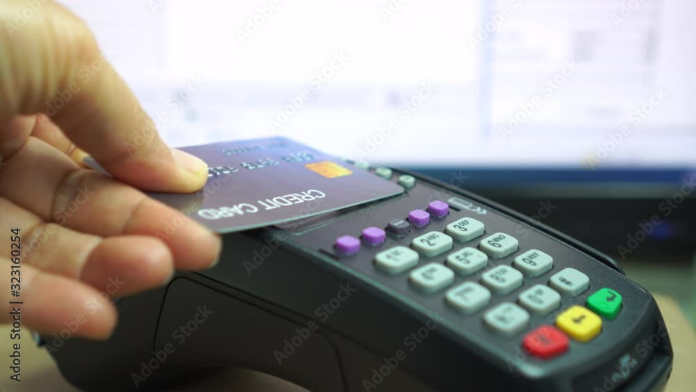Customer using credit cards (mock up) scan nfc for payment, Contactless payments systems credit cards and debit cards, smart cards, Some suppliers claim transactions,business service trade concept Customer using credit cards (mock up) scan nfc for payment, Contactless payments systems credit cards and debit cards, smart cards, Some suppliers claim transactions,business service trade concept