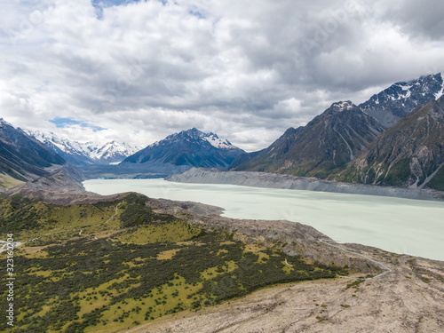 Stunning high angle aerial drone view of Tasman Lake, a proglacial lake formed by the recent retreat of the Tasman Glacier, part of Aoraki/Mount Cook National Park on New Zealand's South Island. photo