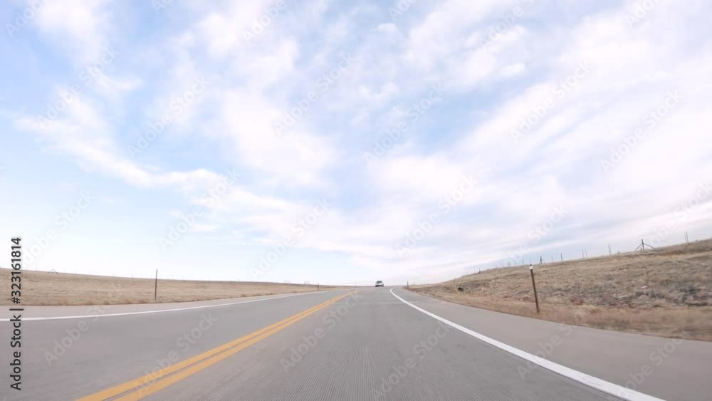 Driving on paved road in rural area. Driving on paved road in rural area.