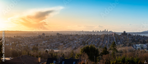 Burnaby, Greater Vancouver, British Columbia, Canada . Beautiful Panoramic View of the city from the top of the hill during a colorful winter sunset. © edb3_16