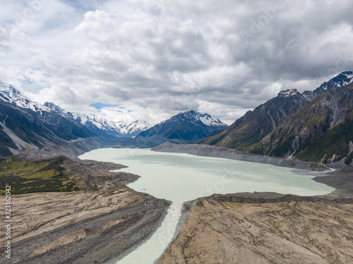 Stunning high angle aerial drone view of Tasman Lake, a proglacial lake formed by the recent retreat of the Tasman Glacier, part of Aoraki/Mount Cook National Park on New Zealand's South Island.