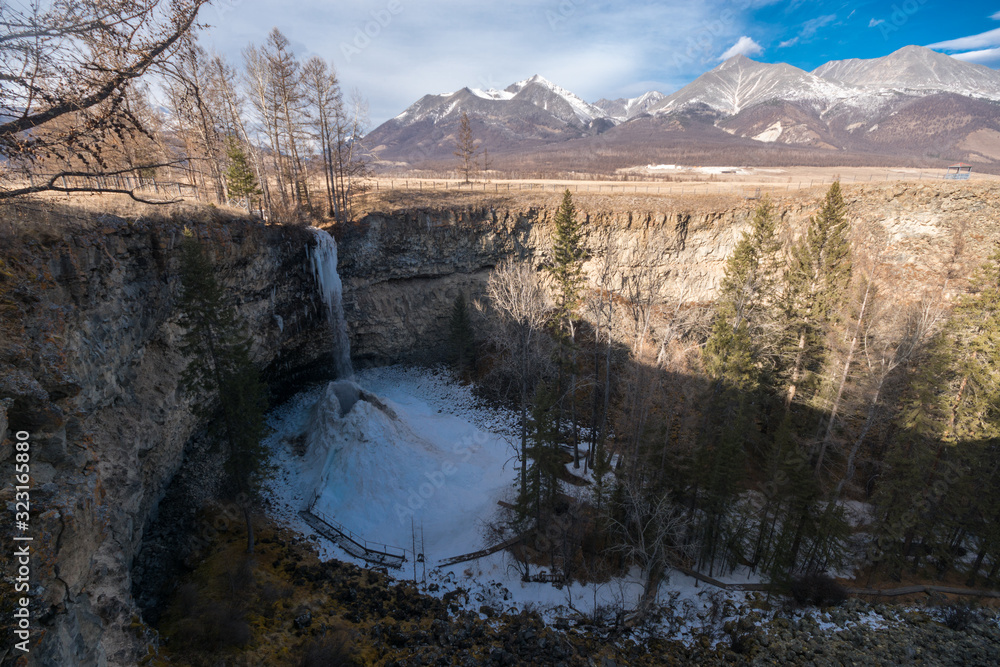 Frozen waterfall on the Small Zhombolok river. Okinsky district of the Buryatia republic