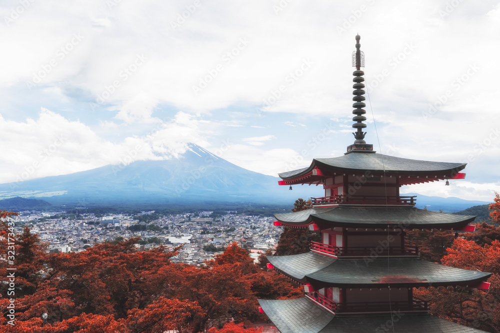 Japanese Pagoda near Mount Fuji with Orange Leaves in Autumn during Cloudy Weather