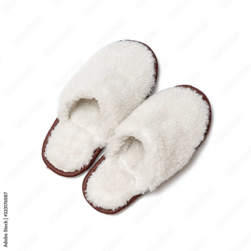 Sheepskin slippers isolated on white background/ Top view/ Close up Sheepskin slippers isolated on white background/ Top view/ Close up