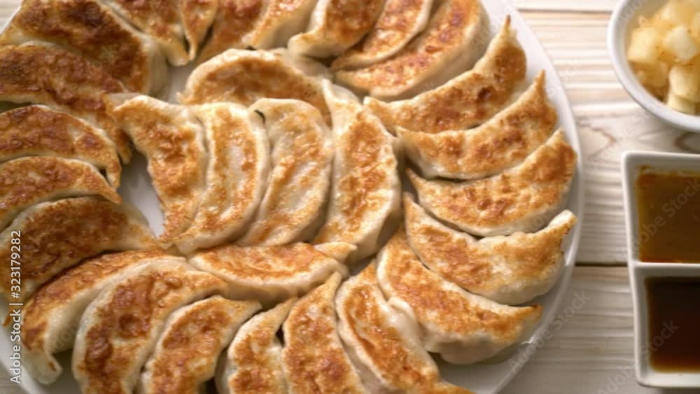fried gyoza or dumplings snack with soy sauce in Japanese style fried gyoza or dumplings snack with soy sauce in Japanese style