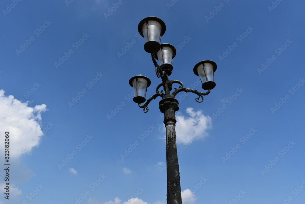 Image of old street lamp on blue sky Image of old street lamp on blue sky