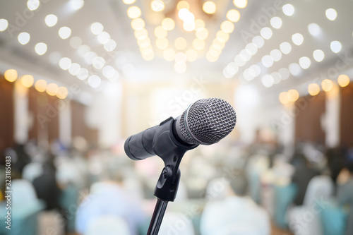 Microphone over the blurred business people forum Meeting Conference Training Learning Coaching Concept, Blurred background.