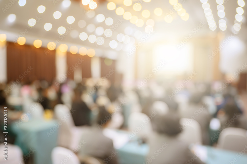 Blurred background of business people in conference hall or seminar room.