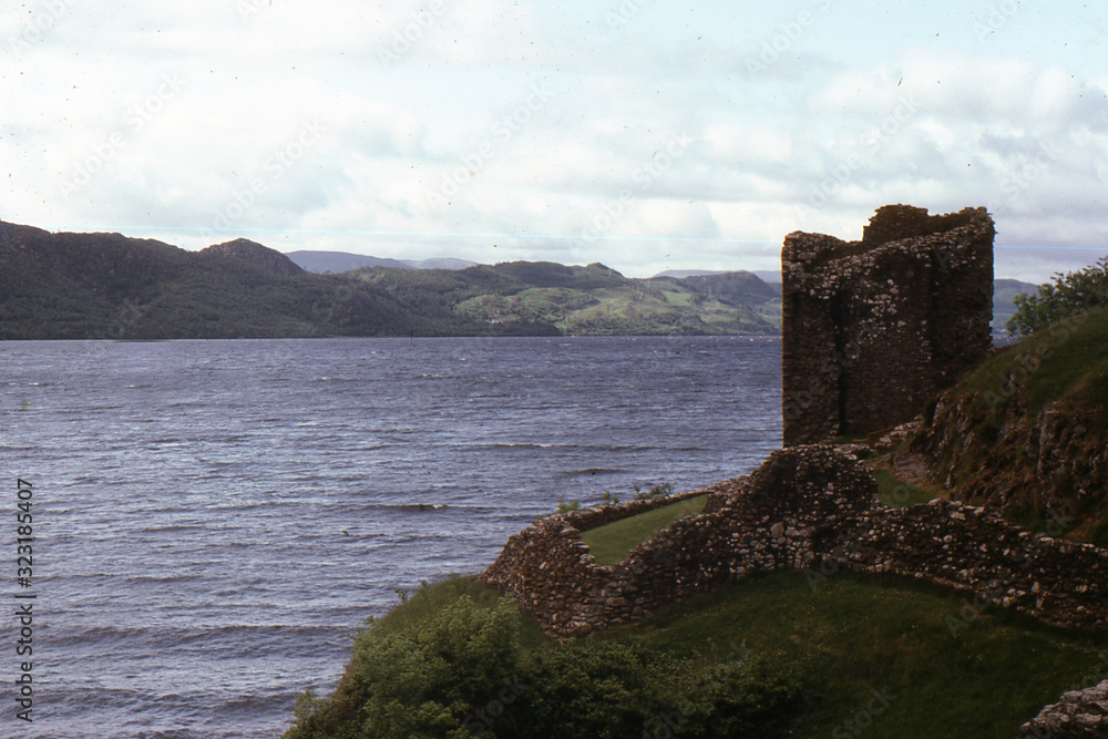 Ruins of an ancient fortress on the banks of Loch ness High Land. Scotland. Great Britain.  Photo on 35 mm film.