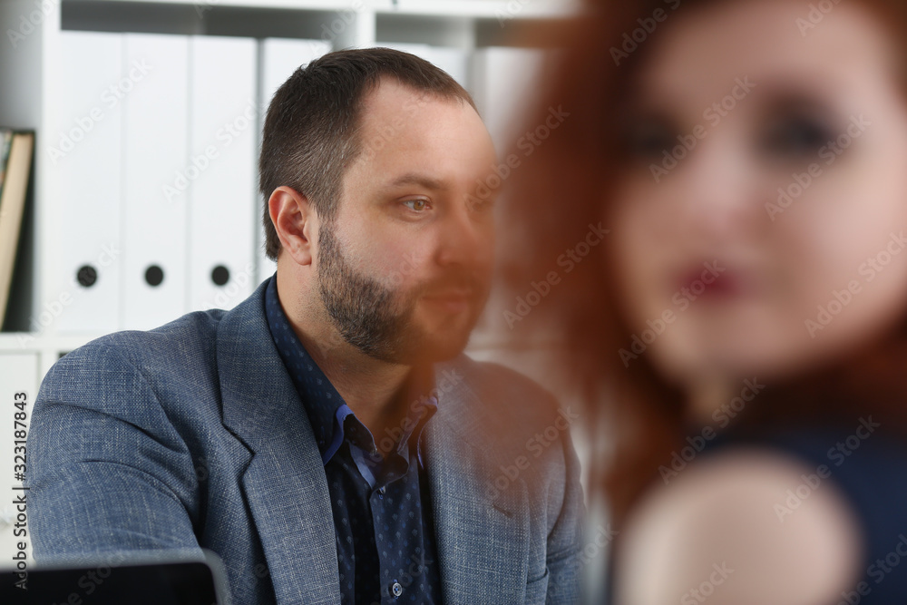 young beautiful red haired woman sit at table in office in cabinet of her boss first place of work concept young beautiful red haired woman sit at table in office in cabinet of her boss first place of work concept