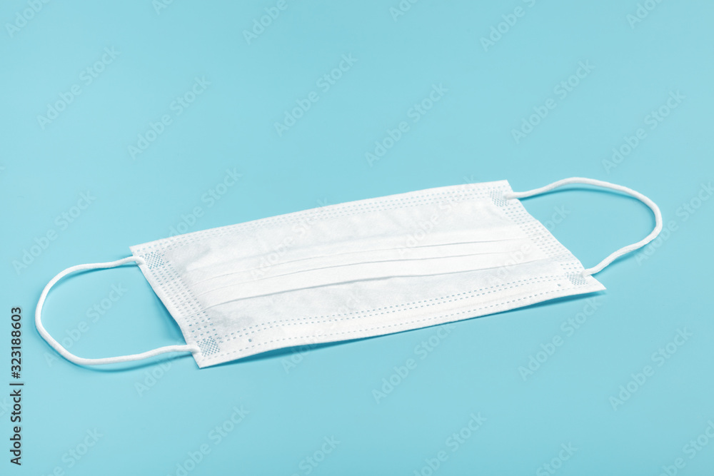 Medical mask on blue background. Medical mask on blue background.