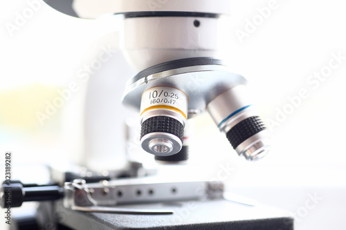 The head microscope on the background laboratory is a study human biology analyzes for non-compliance with the requirements organization public health at international level