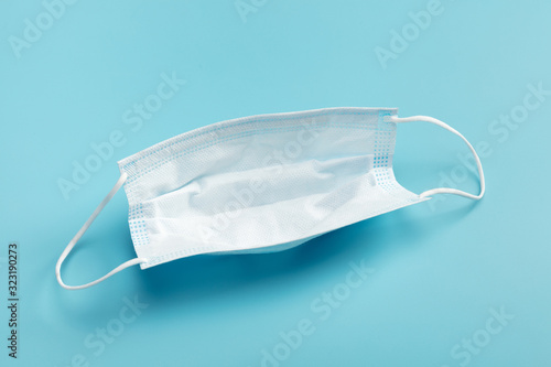 Medical mask on blue background. photo