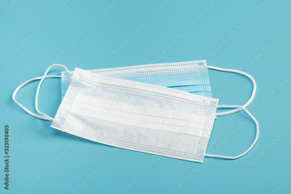 Medical mask on blue background. Medical mask on blue background.