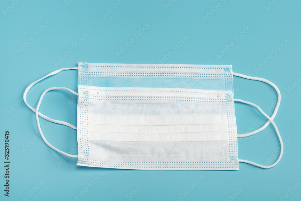 Medical mask on blue background. Medical mask on blue background.