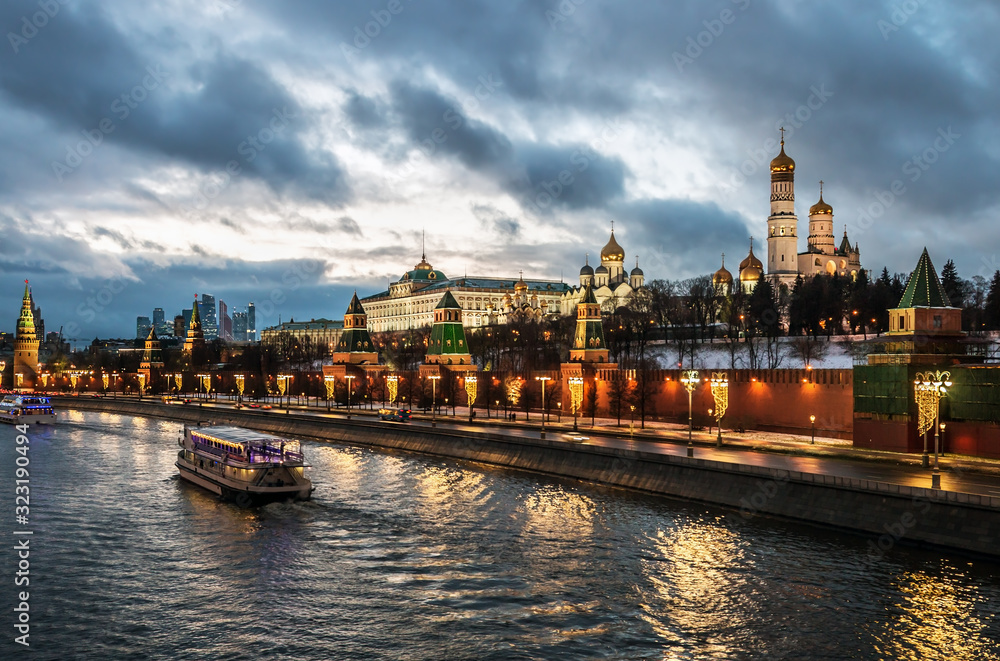 view of the Moscow Kremlin and the Kremlin embankment in Moscow on a winter evening