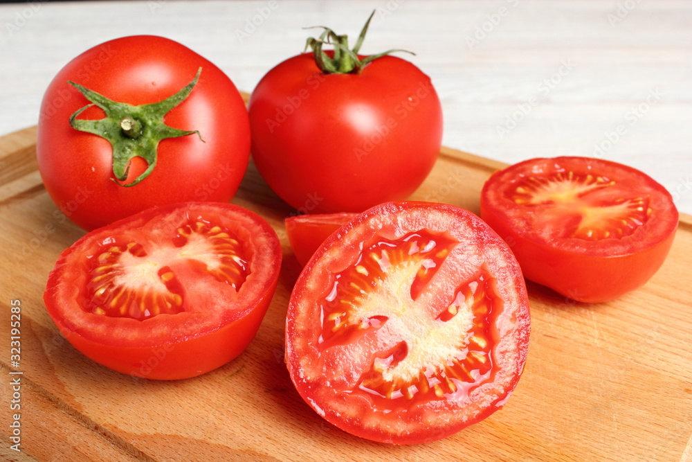 Tomatoes on cutting board Tomatoes on cutting board