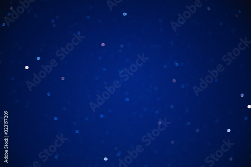 Milky way stars on a dark night sky. Blurred, out of focus image.