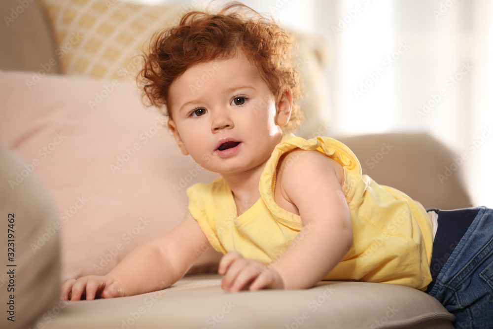 Portrait of cute little child on sofa at home Portrait of cute little child on sofa at home