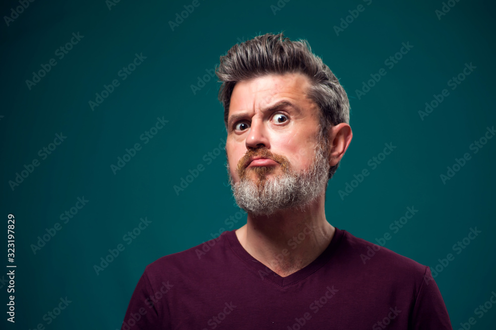 A portrait of bearded surprised man. People and emotions concept A portrait of bearded surprised man. People and emotions concept