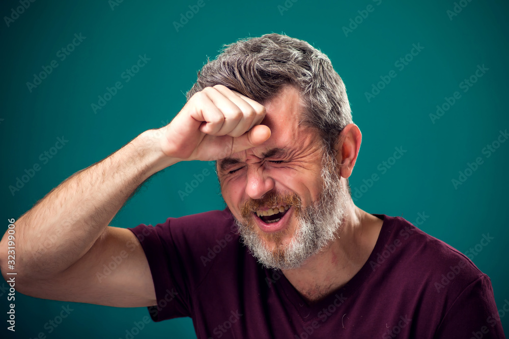 Fototapeta premium A portrait of sad bearded man. People and emotions concept