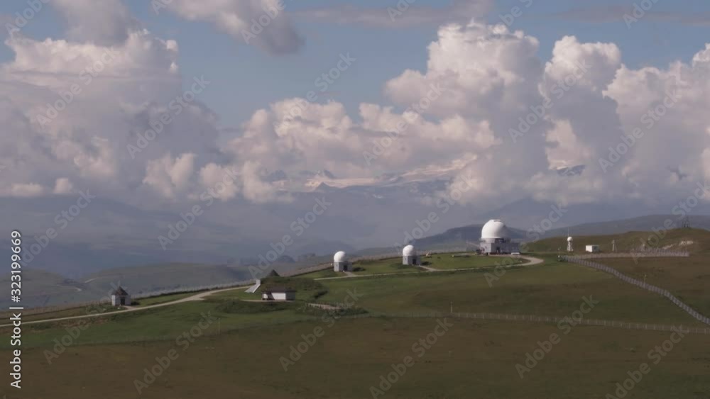 New Astrophysical Observatory with three dome telescope in Karachay-Cherkessia in Caucasus Mountains at summer sunny day - Aerial drone view New Astrophysical Observatory with three dome telescope in Karachay-Cherkessia in Caucasus Mountains at summer sunny day - Aerial drone view