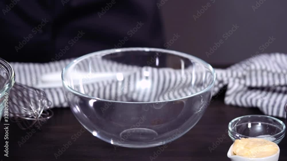 Step by step. Preparing homemade coleslaw in glass mixing bowl. Step by step. Preparing homemade coleslaw in glass mixing bowl.