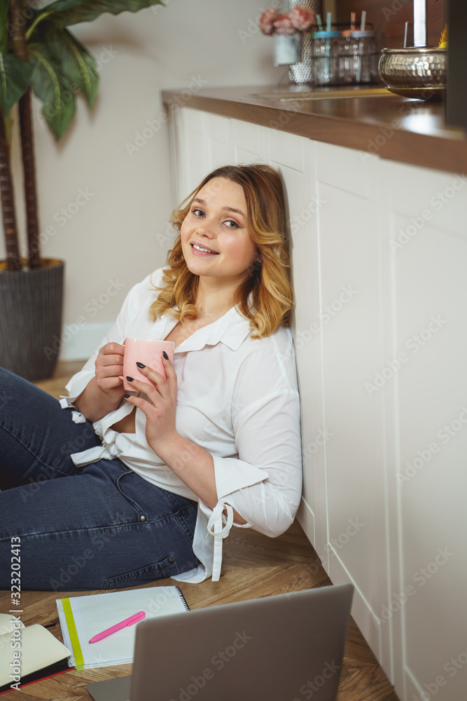 Kind curly haired female having break for tea Kind curly haired female having break for tea