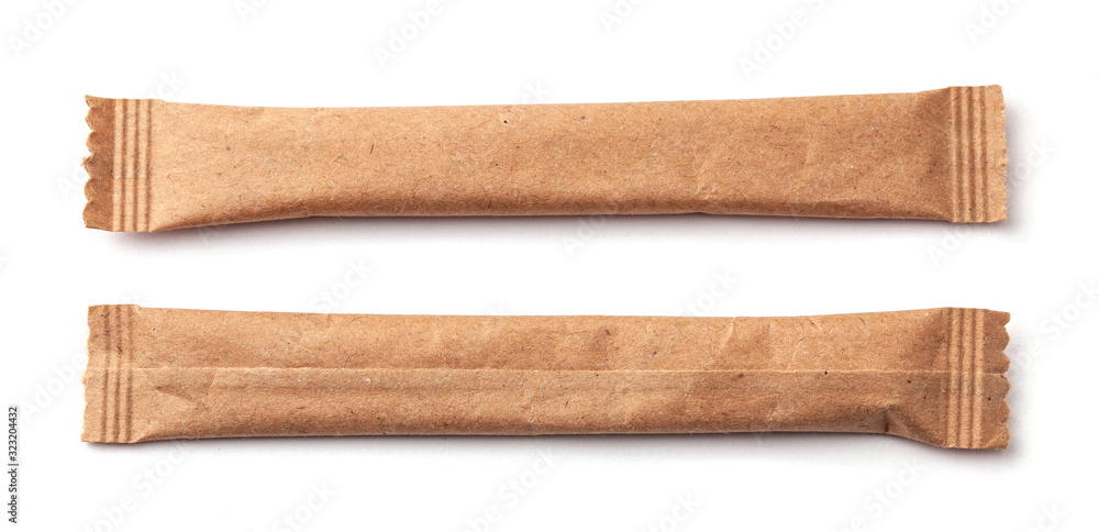 Two Sugar Stick. Sugar in paper kraft packaging. Mock up for design isolated on white background Two Sugar Stick. Sugar in paper kraft packaging. Mock up for design isolated on white background