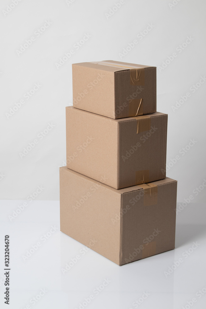 Pile of various size taped up cardboard boxes Pile of various size taped up cardboard boxes