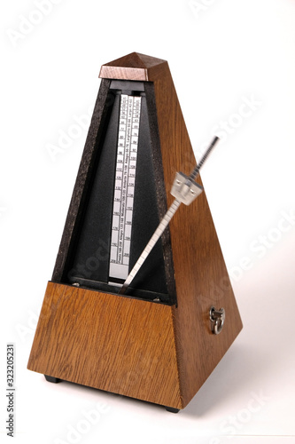 Quadro su tela old metronome on a white background