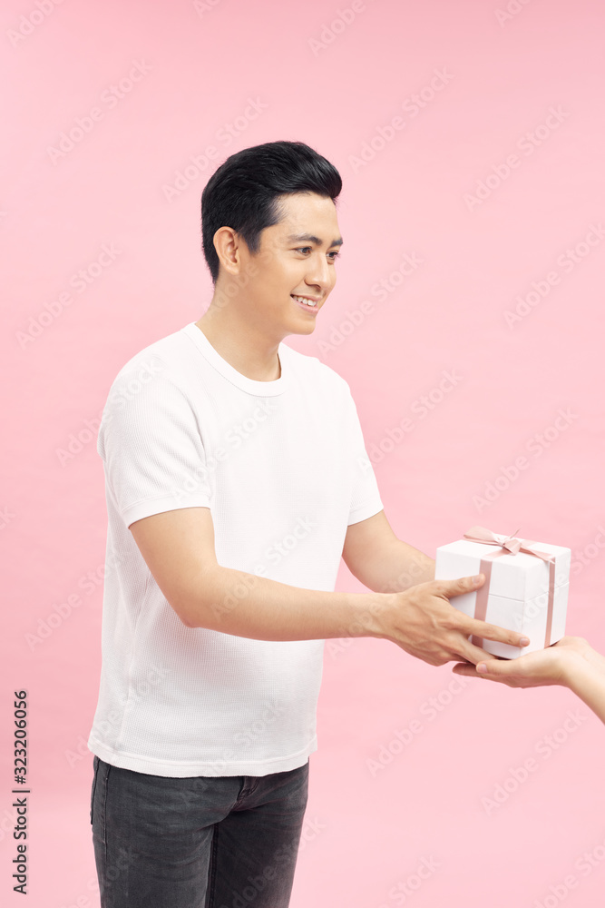 bright picture of handsome man with a gift . bright picture of handsome man with a gift .