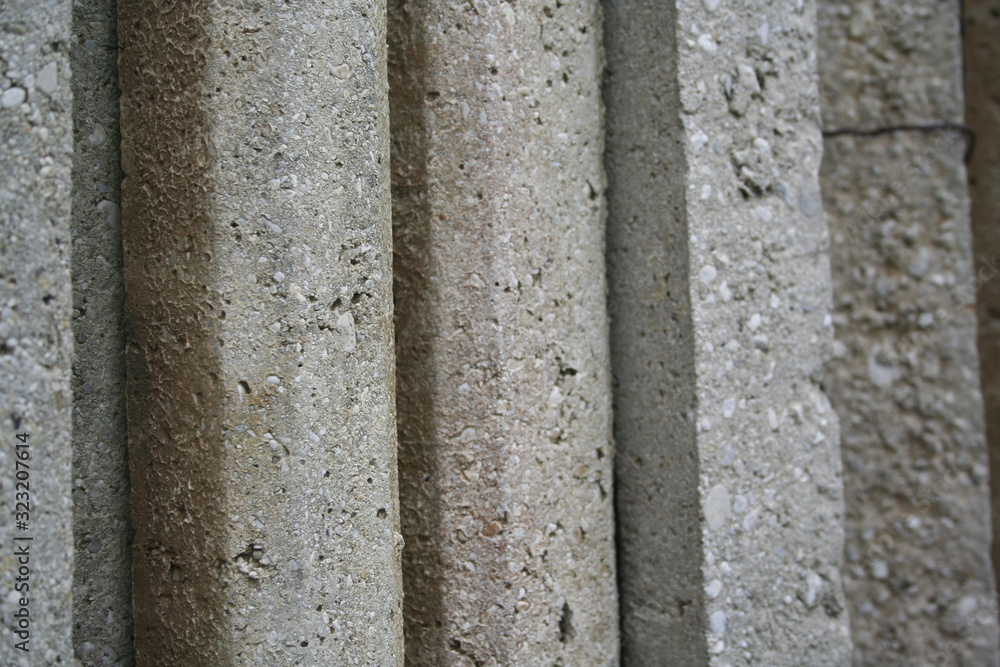 Group of concrete poles for fence. Concrete poles on selective focus Group of concrete poles for fence. Concrete poles on selective focus