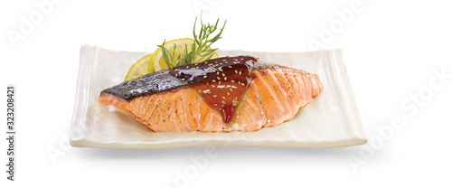 Grilled salmon teriyaki on white plate, isolated on whit background with clipping path.