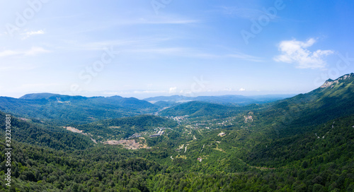 Amazing view of the landslide on a mountain road near Naqerala Pass and Cxrajvari mountain. Serpentine road and and view of the city of Tkibuli. Georgia