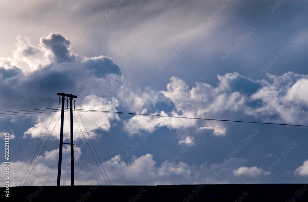 Power lines in front of winter clouds Power lines in front of winter clouds