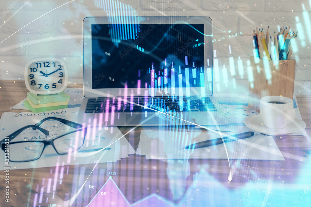 Financial market graph hologram and personal computer on background. Double exposure. Concept of forex. Financial market graph hologram and personal computer on background. Double exposure. Concept of forex.