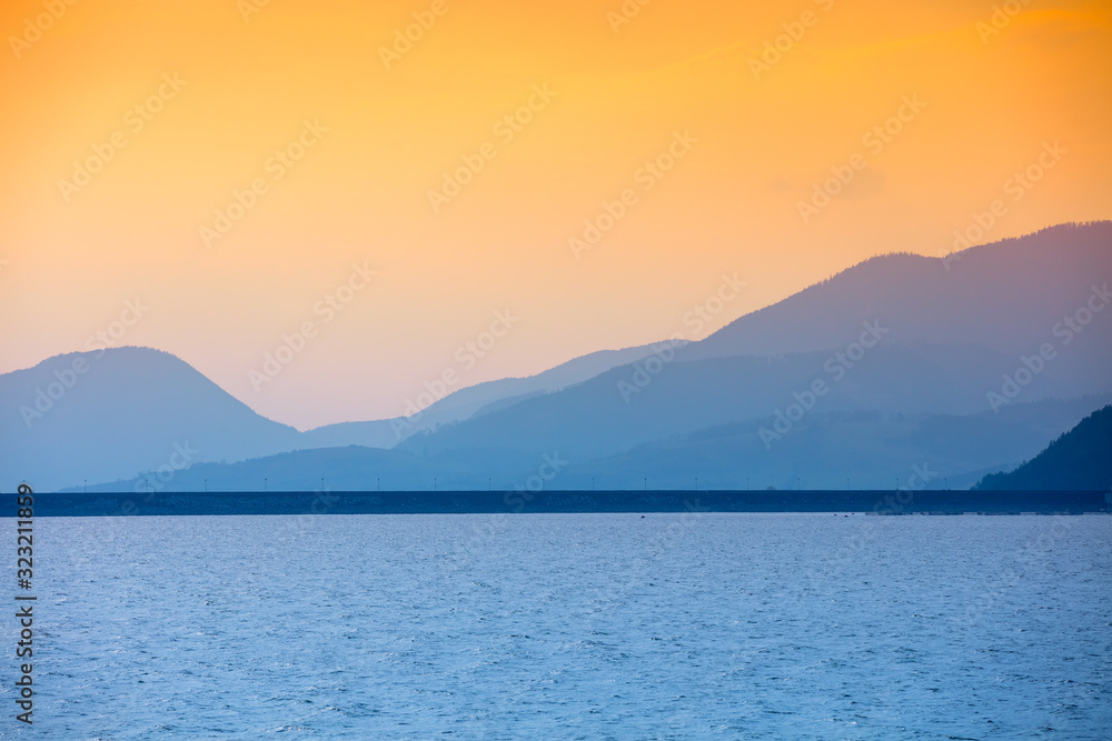 Silhouette of mountains against a sunset sky. Liptov sea. Nature of Slovak Republic, Europe
