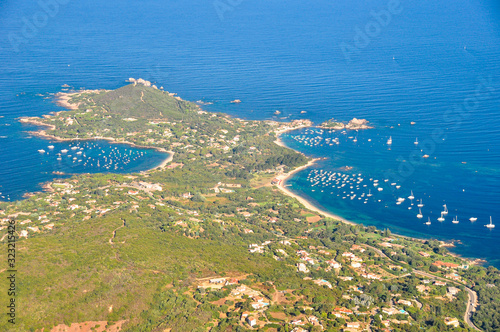 Aerial shot of Porticcio Isolella Pietrosella beach in Corsica near Ajaccio taken from a plane on a summer day
